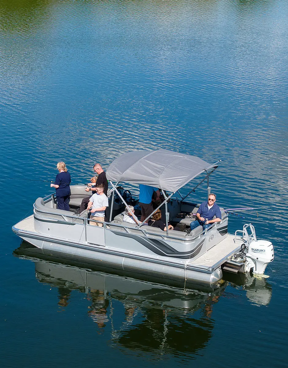 Individuals fishing from a small boat as part of a group retreat experience