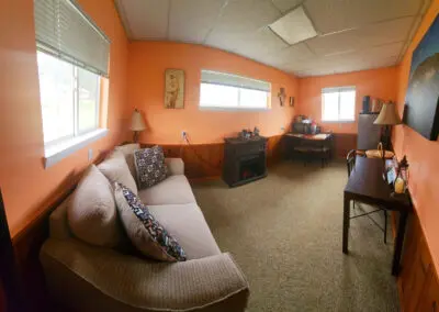 Interior view of the LaVerna Hermitage lodge, a cozy retreat for up to 2 guests seeking a spiritual renewal center